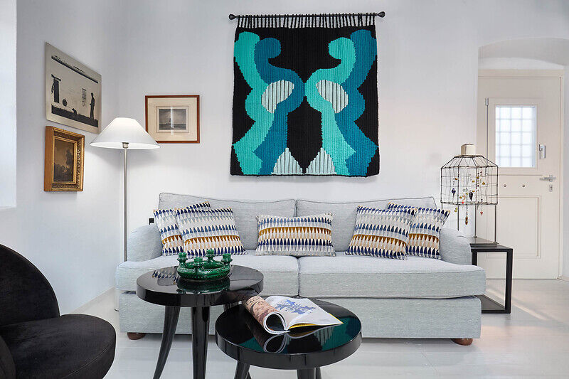 vibrant blue facade brings new life to the monk retreat on leros island, greece