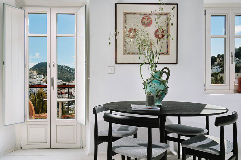 vibrant blue facade brings new life to the monk retreat on leros island, greece