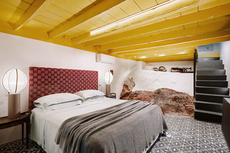 vibrant blue facade brings new life to the monk retreat on leros island, greece