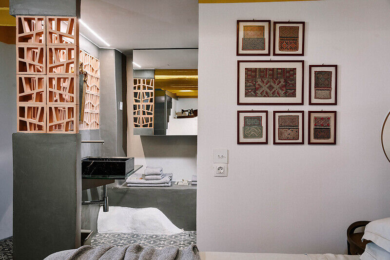 vibrant blue facade brings new life to the monk retreat on leros island, greece