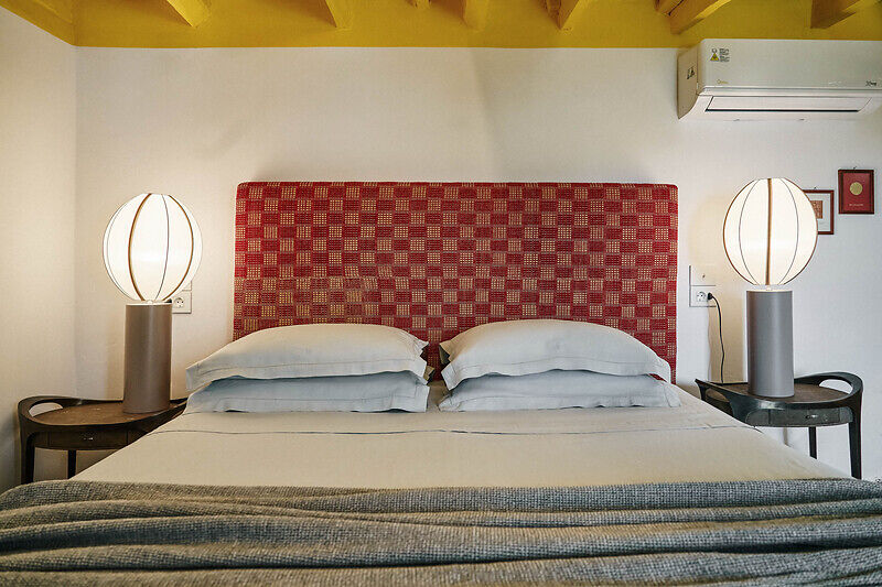 vibrant blue facade brings new life to the monk retreat on leros island, greece