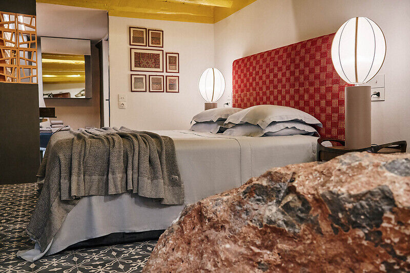 vibrant blue facade brings new life to the monk retreat on leros island, greece