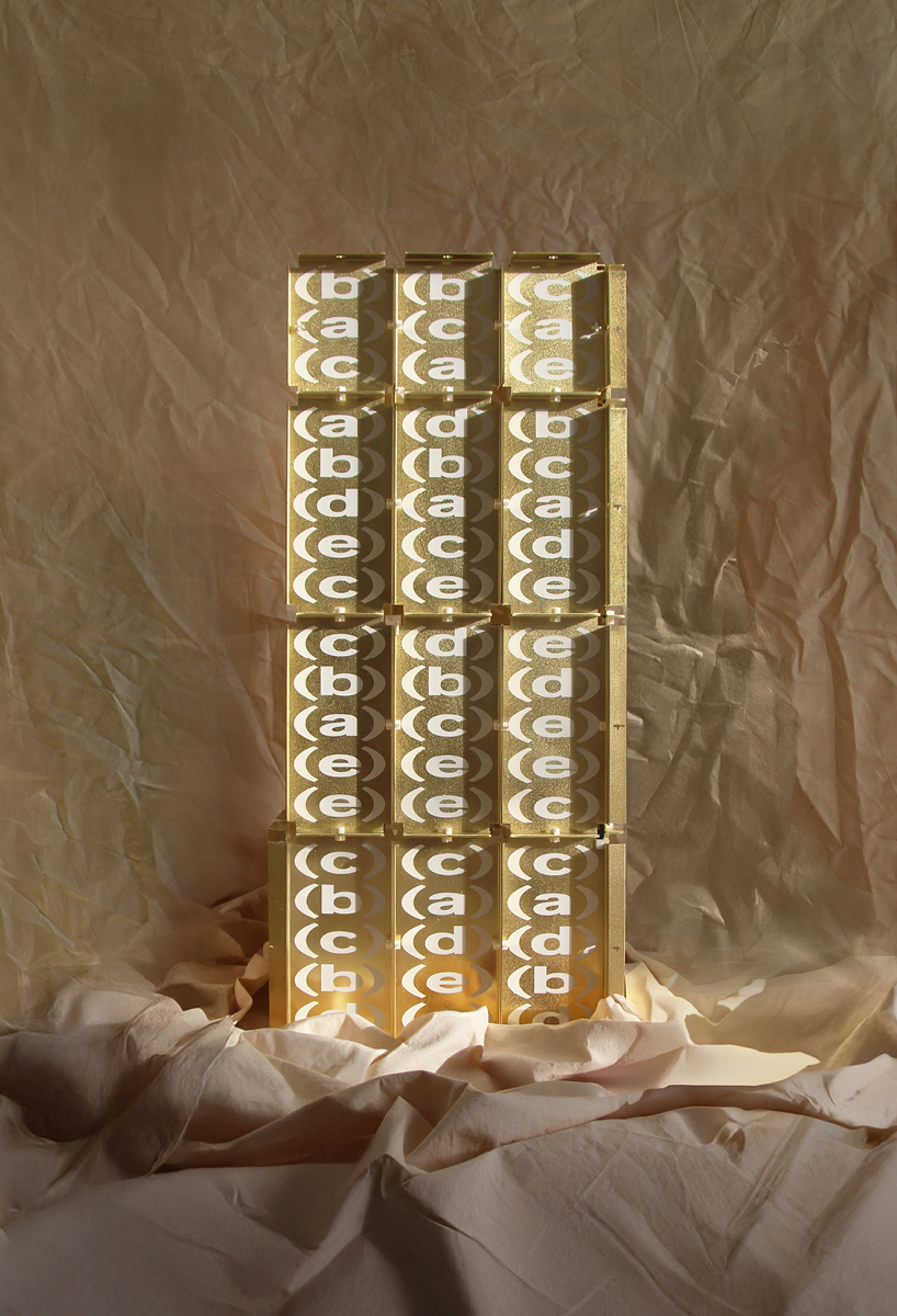 letters printed across brass chair turn mathematical paradox into NYC political commentary