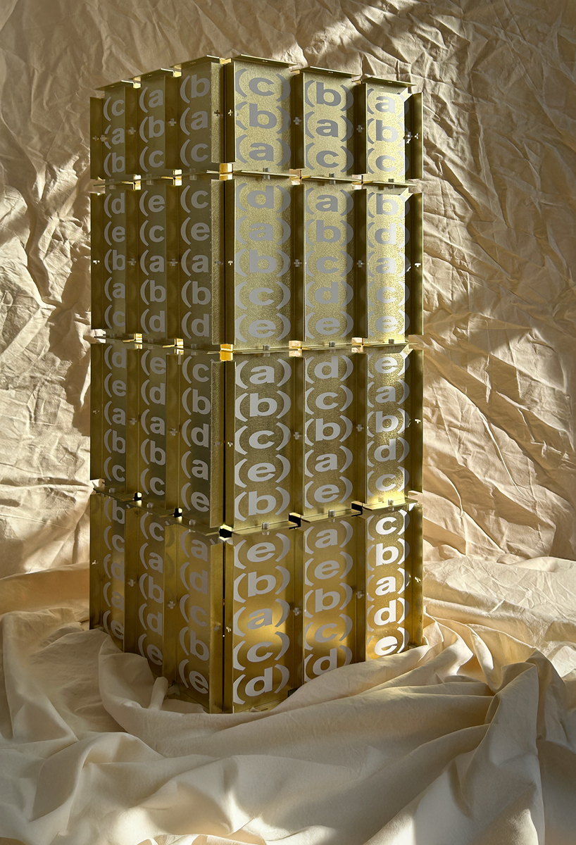 letters printed across brass chair turn mathematical paradox into NYC political commentary