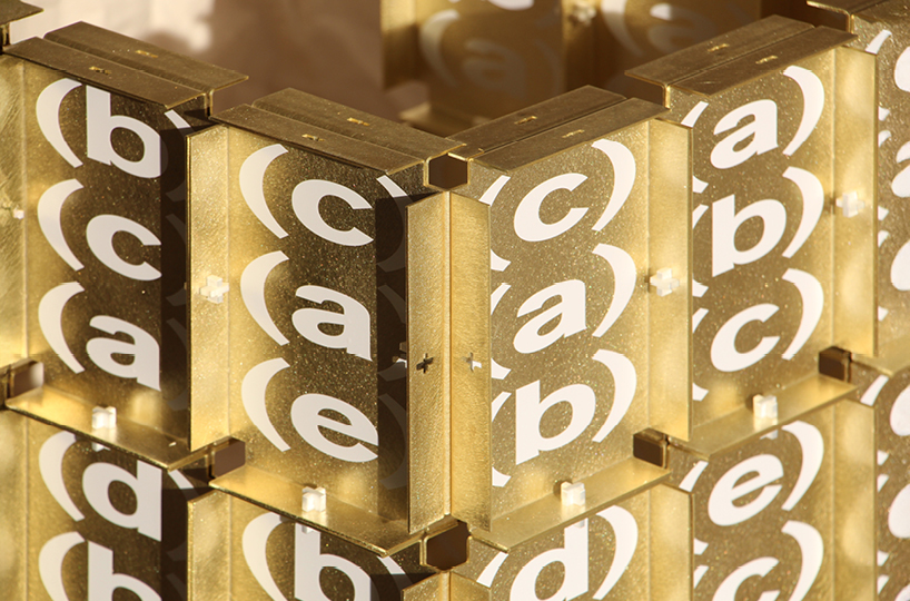 letters printed across brass chair turn mathematical paradox into NYC political commentary