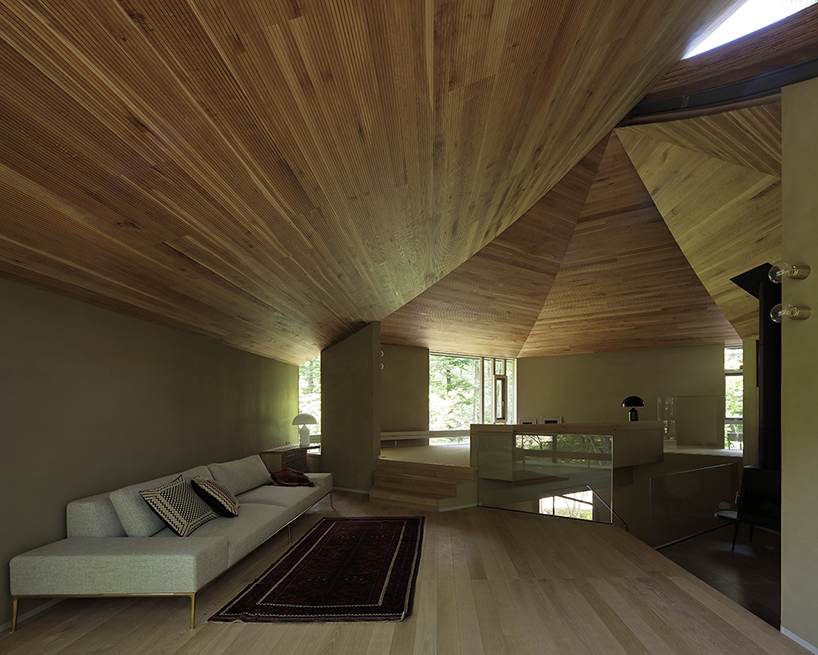 hexagonal wooden canopy crowns villa within moss garden in japan