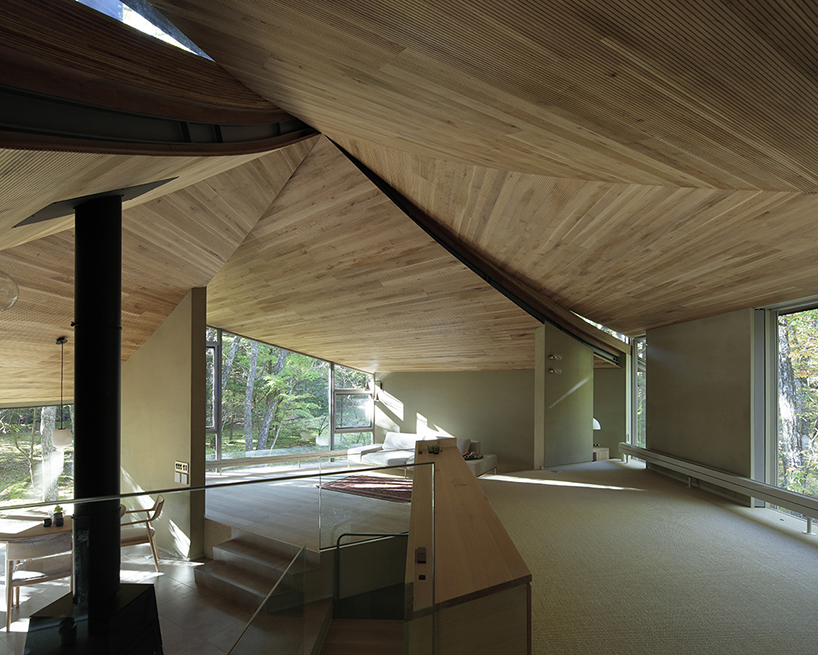hexagonal wooden canopy crowns villa within moss garden in japan