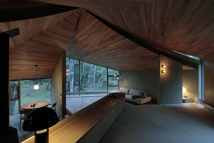 hexagonal wooden canopy crowns villa within moss garden in japan