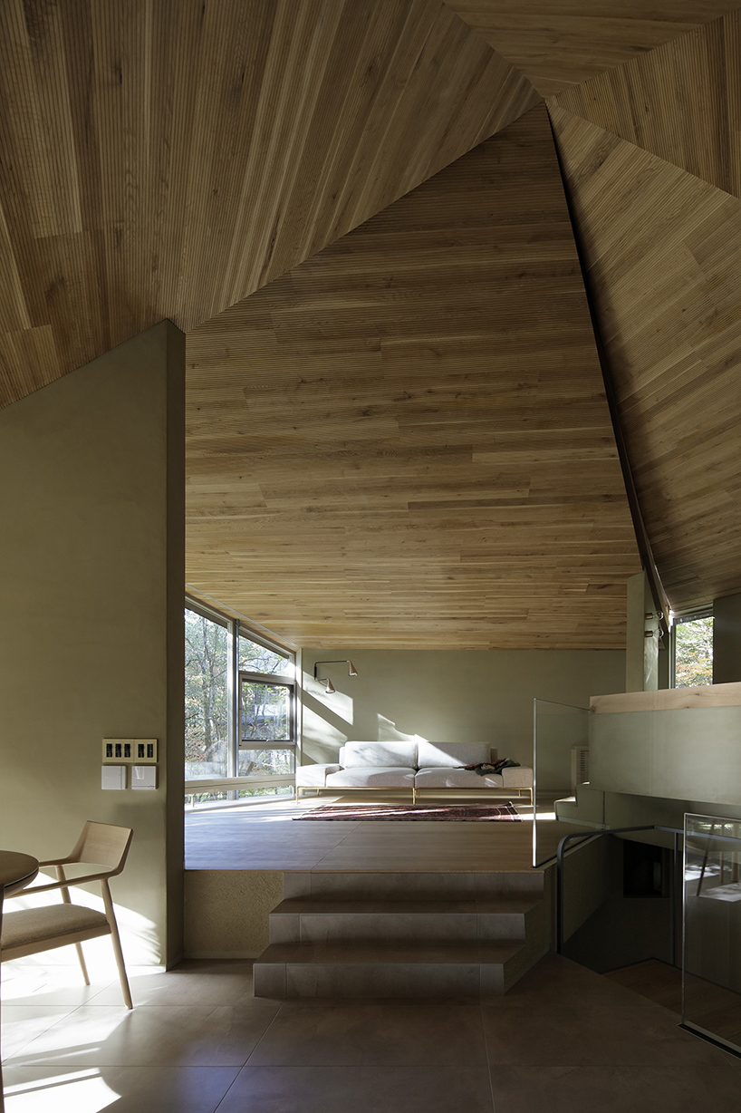 hexagonal wooden canopy crowns villa within moss garden in japan