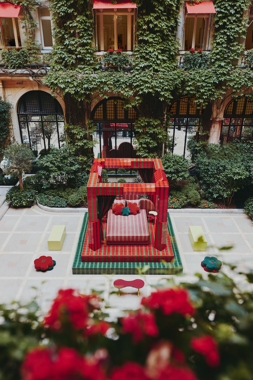 green and red ceramic tiles clad sculptural daybed by uchronia at hôtel plaza athénée, paris