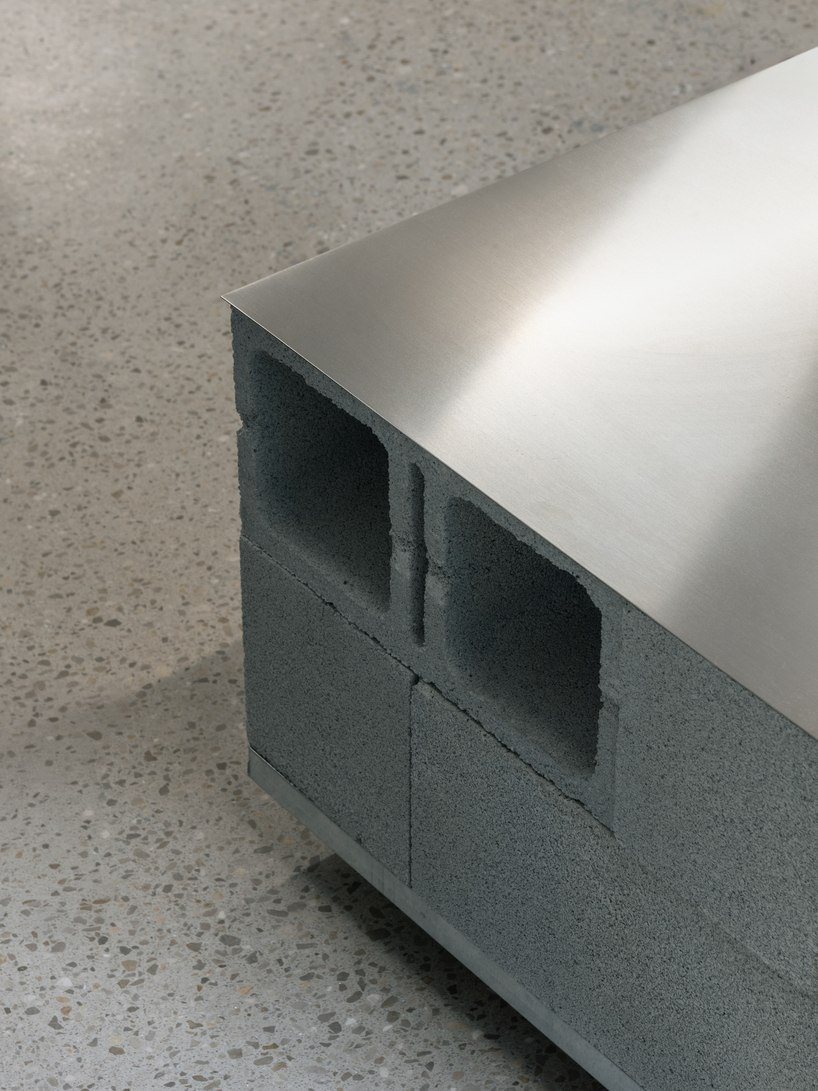 blok tattoo studio in barcelona redefines sterile spaces through concrete and steel interiors