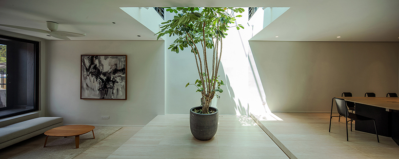 porous white brickwork facade enfolds renovated 1980s terrace house in kuala lumpur