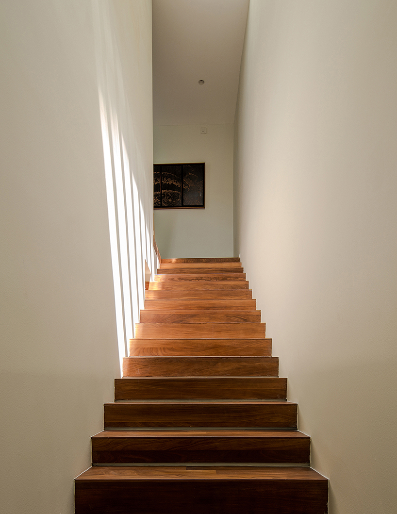 porous white brickwork facade enfolds renovated 1980s terrace house in kuala lumpur