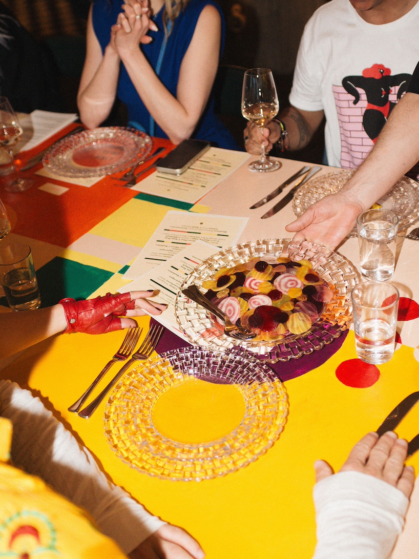 35-meter hand-painted table transforms dining into an immersive installation in berlin - 9