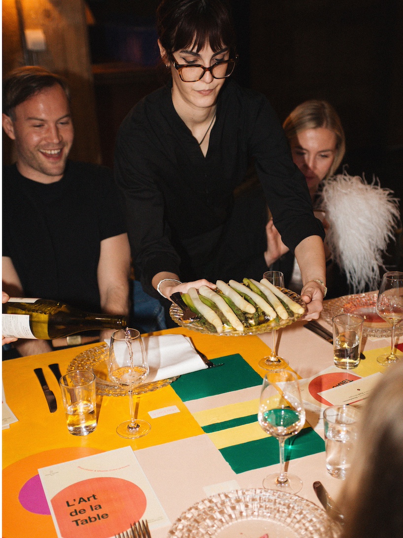 35-meter hand-painted table transforms dining into an immersive installation in berlin - 10