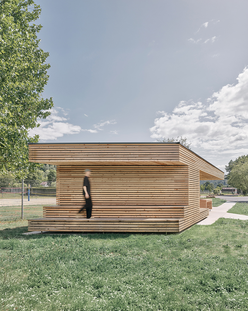 tob.studio’s timber bike station in germany resembles stacked log pile - 4