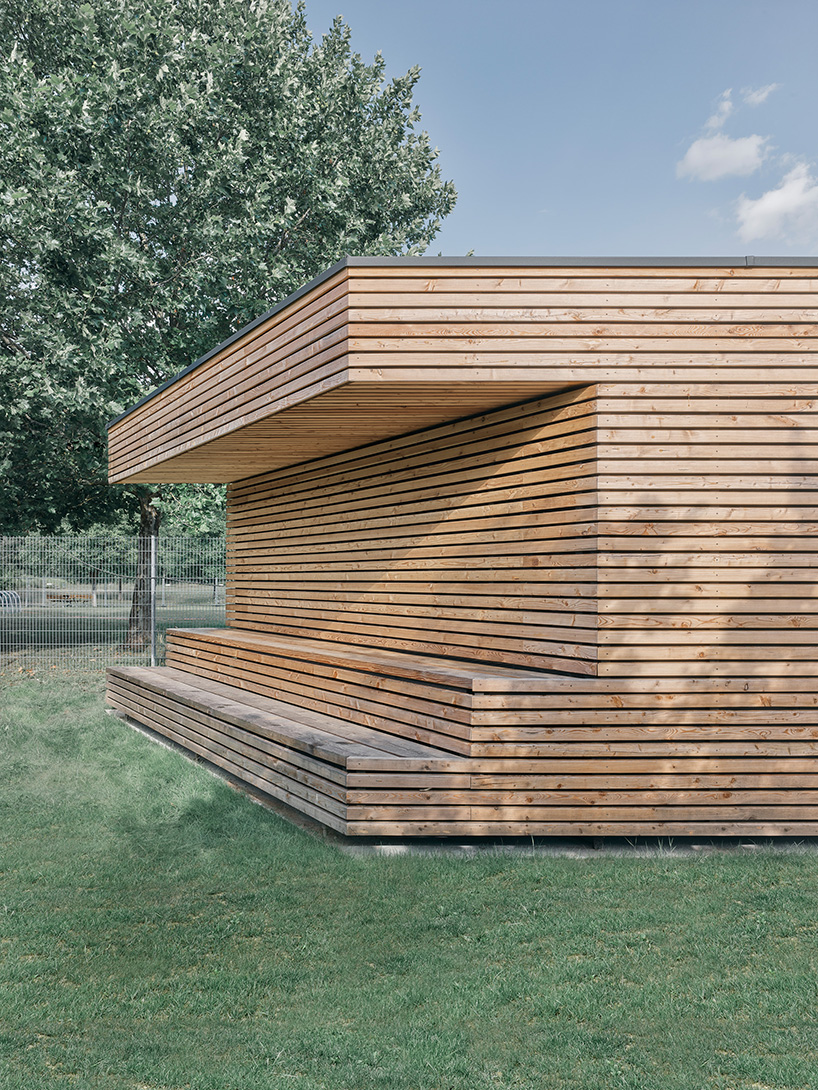 tob.studio’s timber bike station in germany resembles stacked log pile - 6