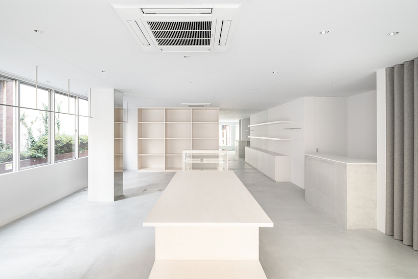 white-stained wood shapes soft bright interiors for tokyo apparel store