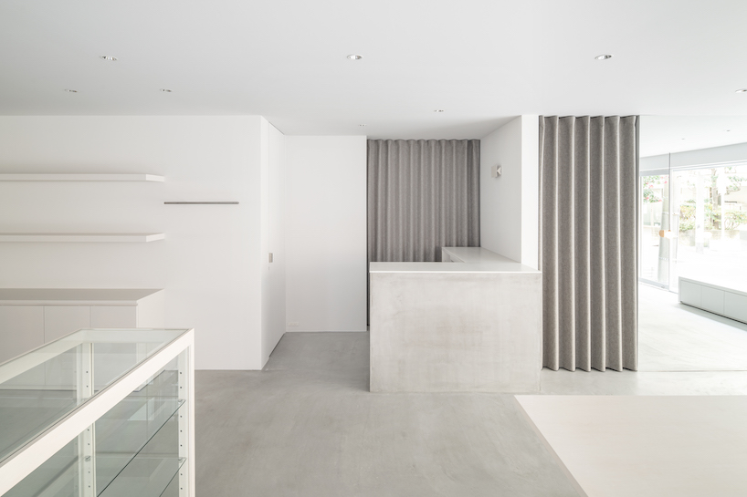 white-stained wood shapes soft bright interiors for tokyo apparel store