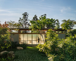 oversized boulders and native trees determine footprint of timber pavilion in brazil