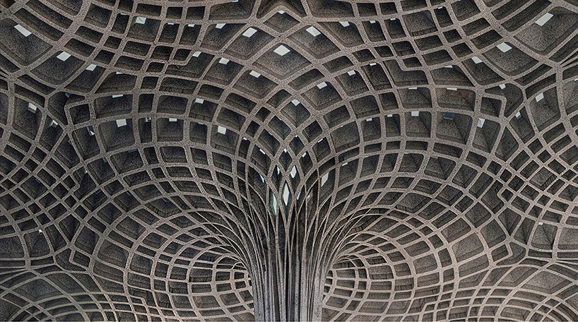 thin stone carves sculptural cathedral emerging from spanish mountains