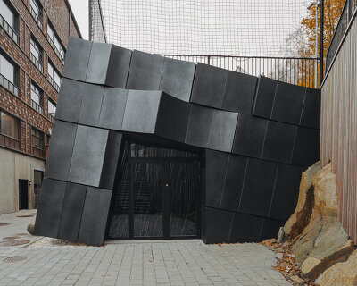 erdegard arkitekter carves 'mountain chamber' threshold to rock cavern in sweden