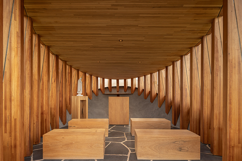 curving concrete walls encircle nest chapel’s intimate timber core in são paulo