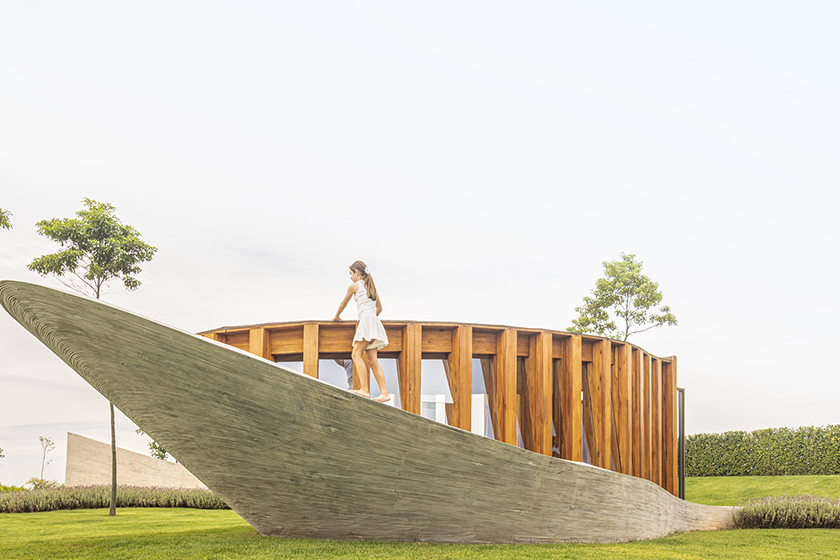 curving concrete walls encircle nest chapel’s intimate timber core in são paulo