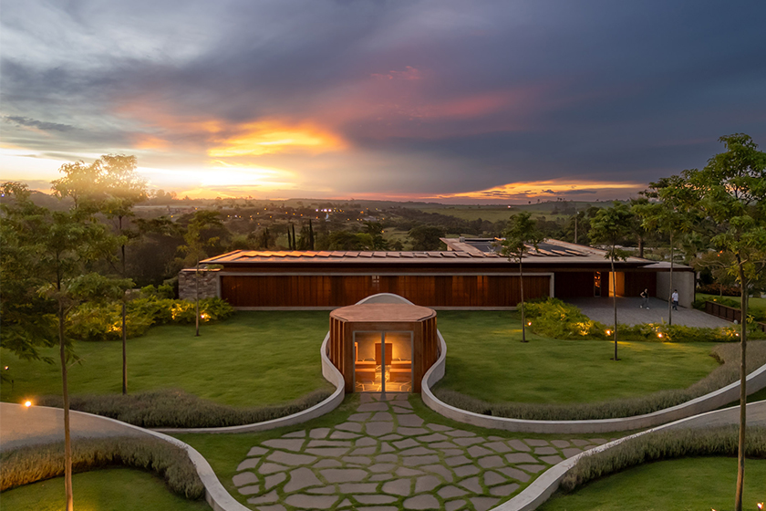curving concrete walls encircle nest chapel’s intimate timber core in são paulo
