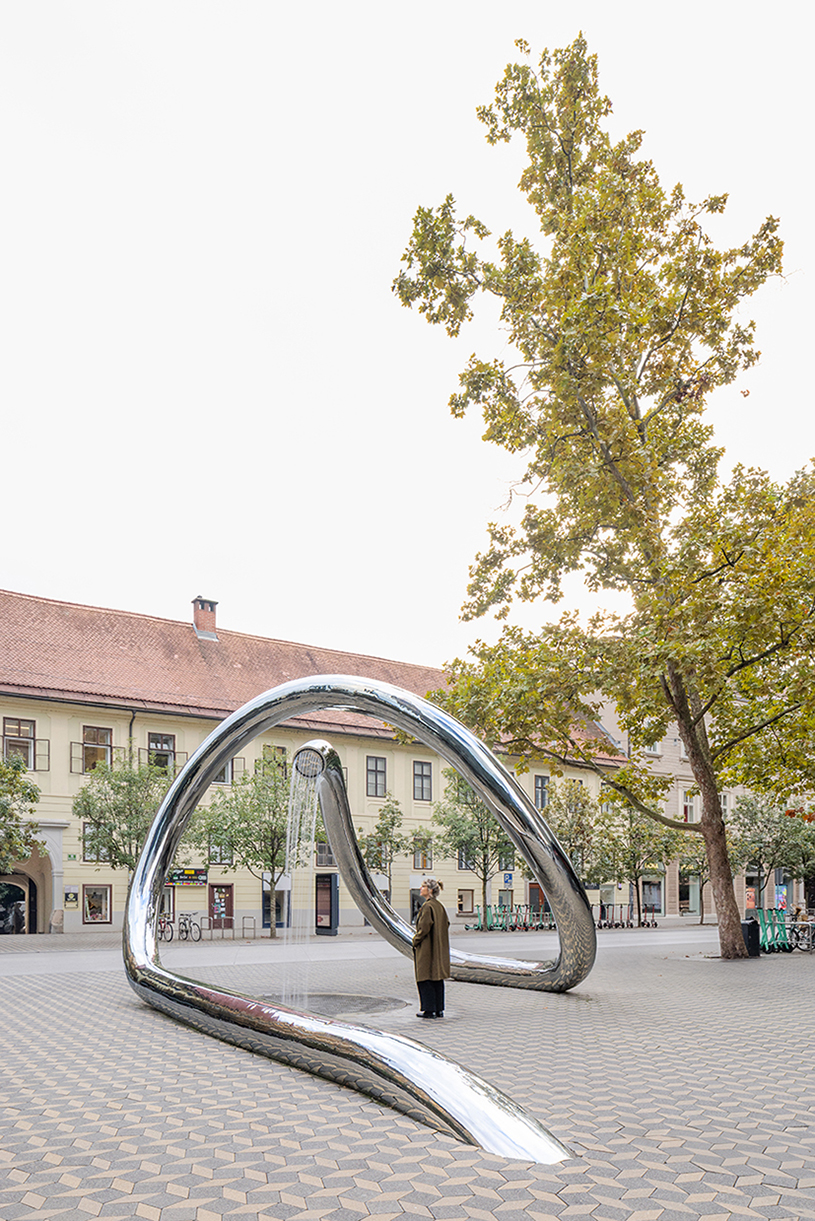 continuous steel loop forms water sculpture reflecting ljubljana&rsquo;s urban fabric
