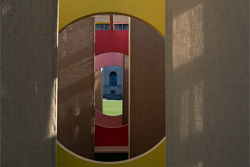jute fabric walls and shifting pathways form delulu interactive labyrinth - 6