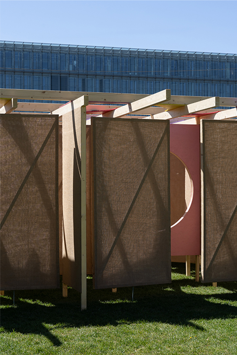jute fabric walls and shifting pathways form delulu interactive labyrinth - 7