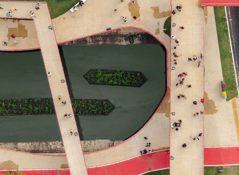 elevated linear park reclaims canal runing along brazilian city center