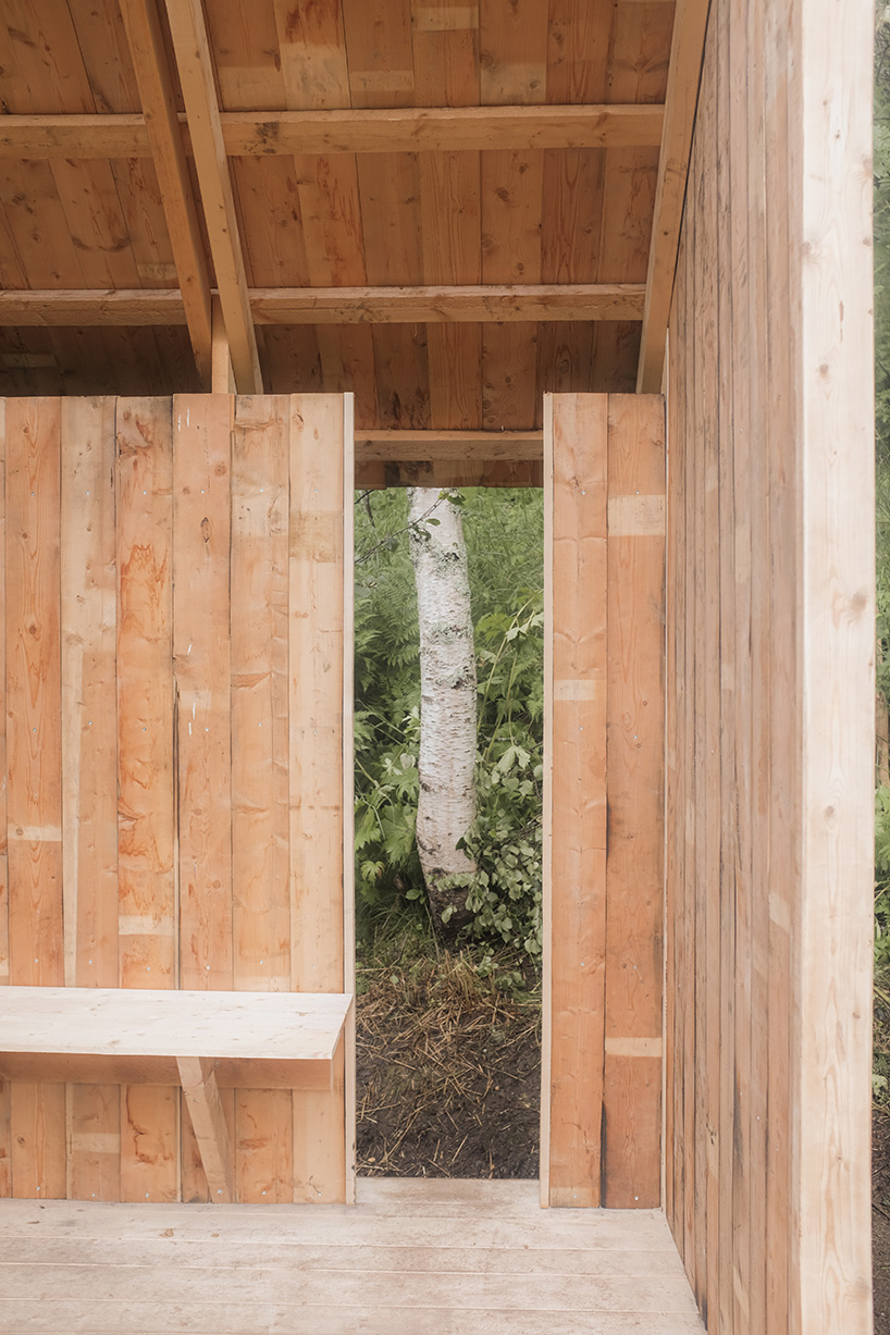 student collective builds fireplace shelter from reclaimed materials in northern norway