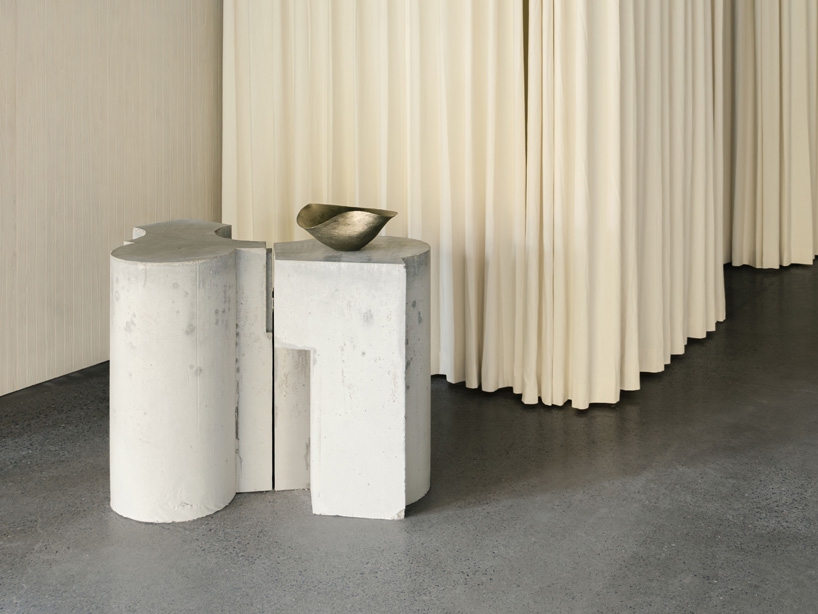 continuous steel rail traces shanghai showroom&rsquo;s sculptural interior, like a freehand drawing