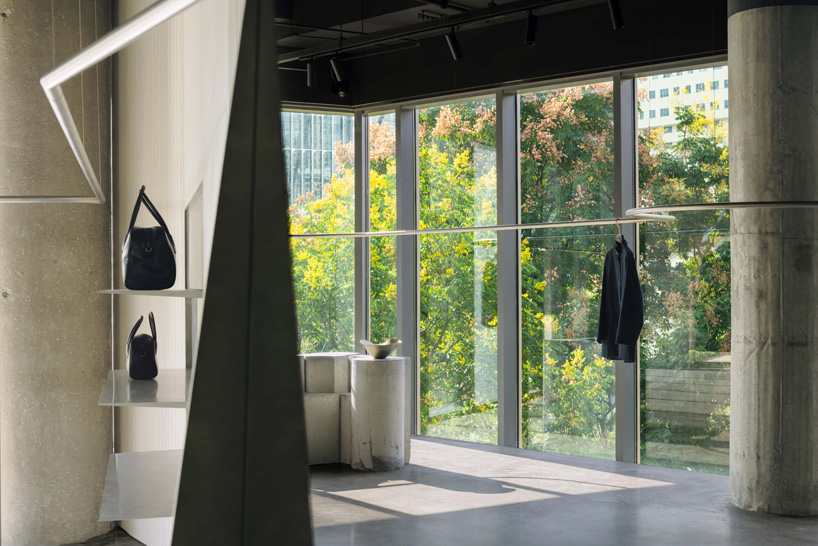 continuous steel rail traces shanghai showroom&rsquo;s sculptural interior, like a freehand drawing