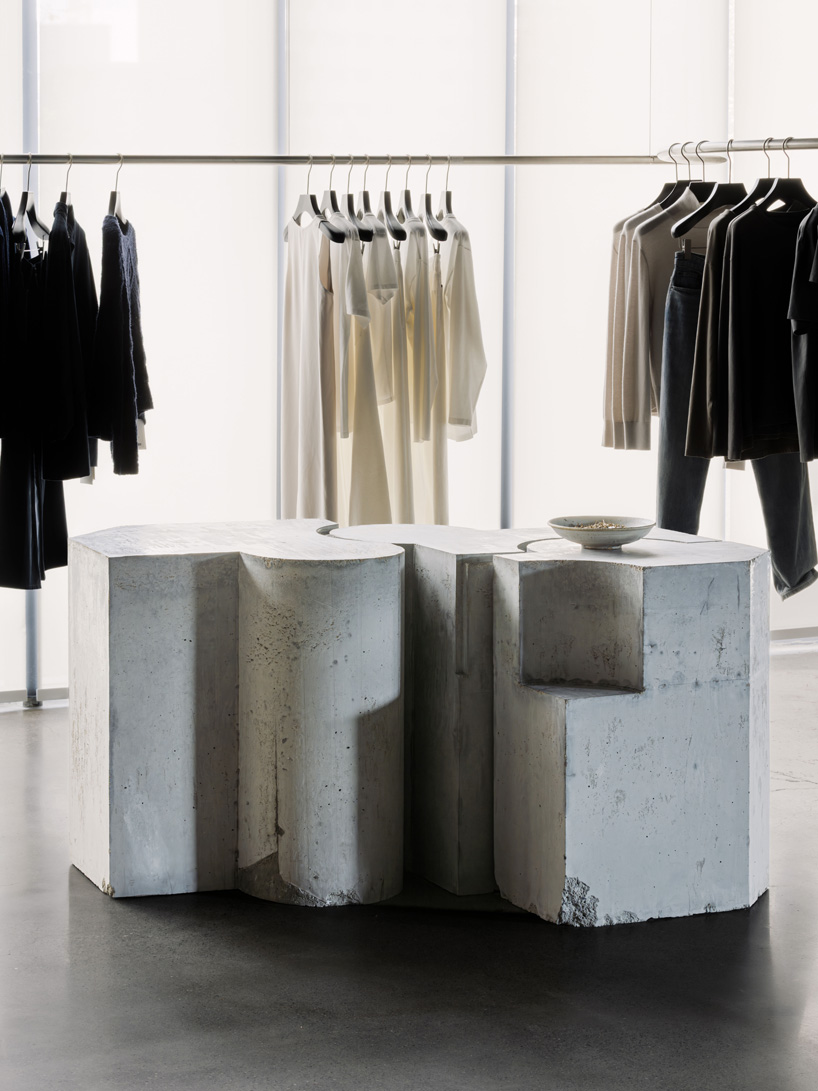 continuous steel rail traces shanghai showroom&rsquo;s sculptural interior, like a freehand drawing