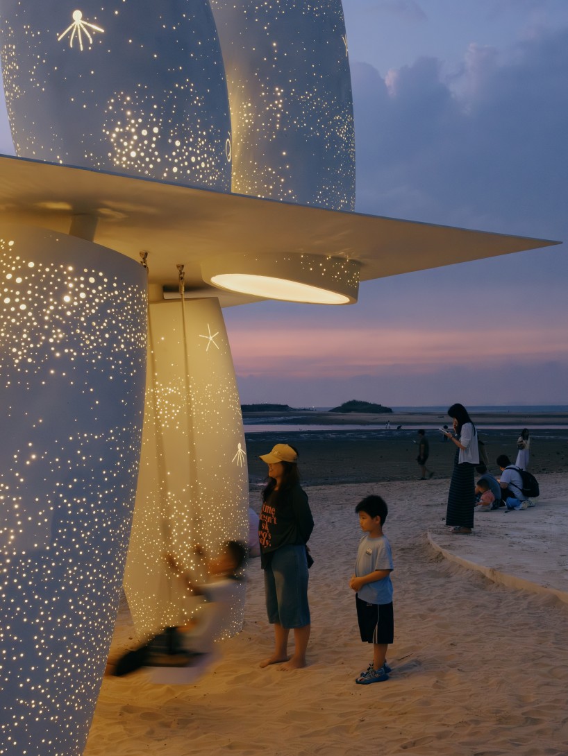 white stainless-steel cylinders form coral-like swing installation on chinese coast - 11