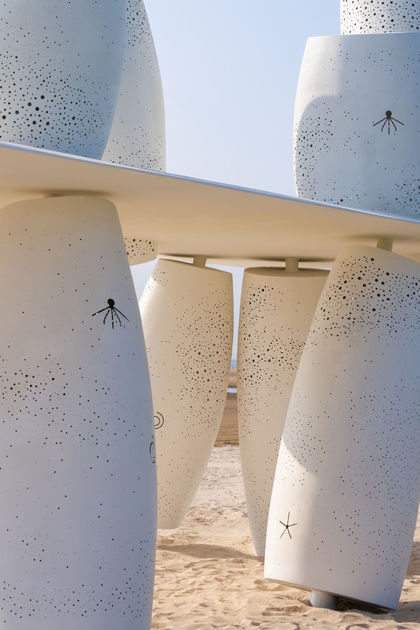 white stainless-steel cylinders form coral-like swing installation on chinese coast - 4