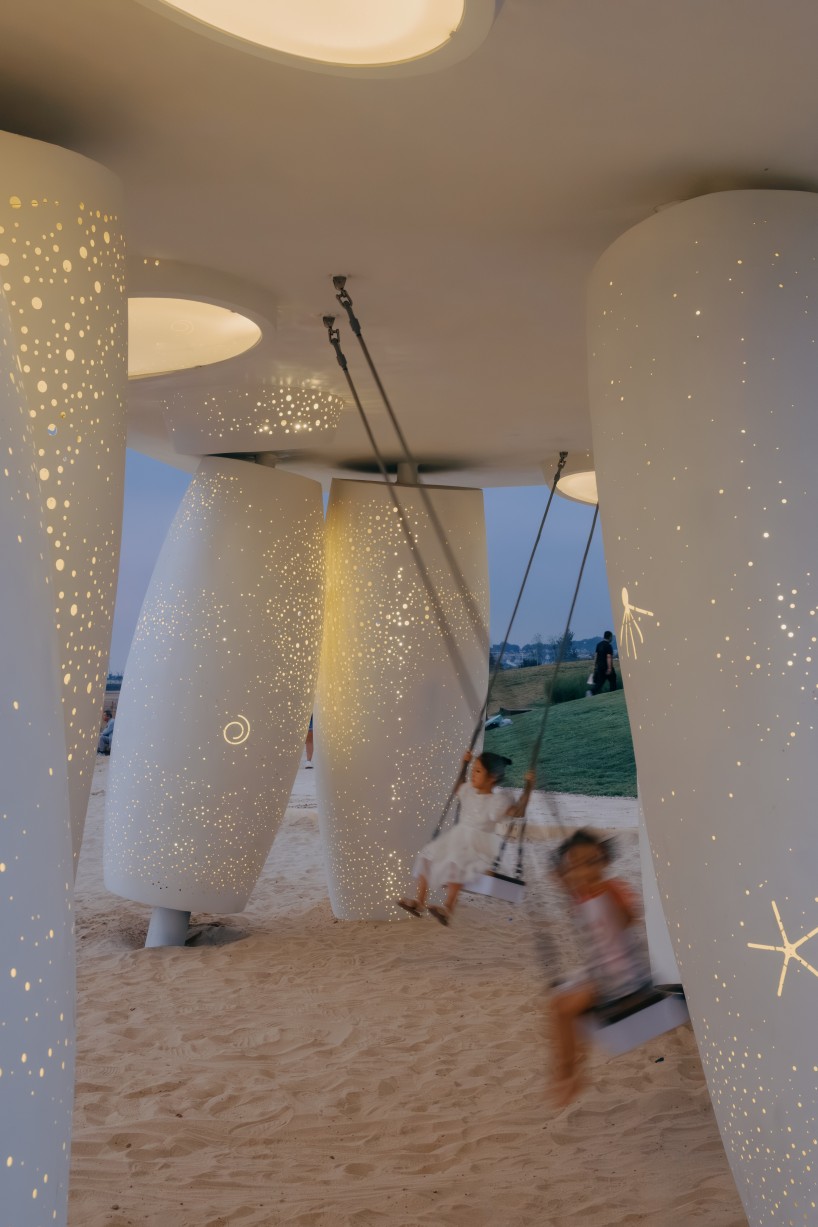 white stainless-steel cylinders form coral-like swing installation on chinese coast - 10