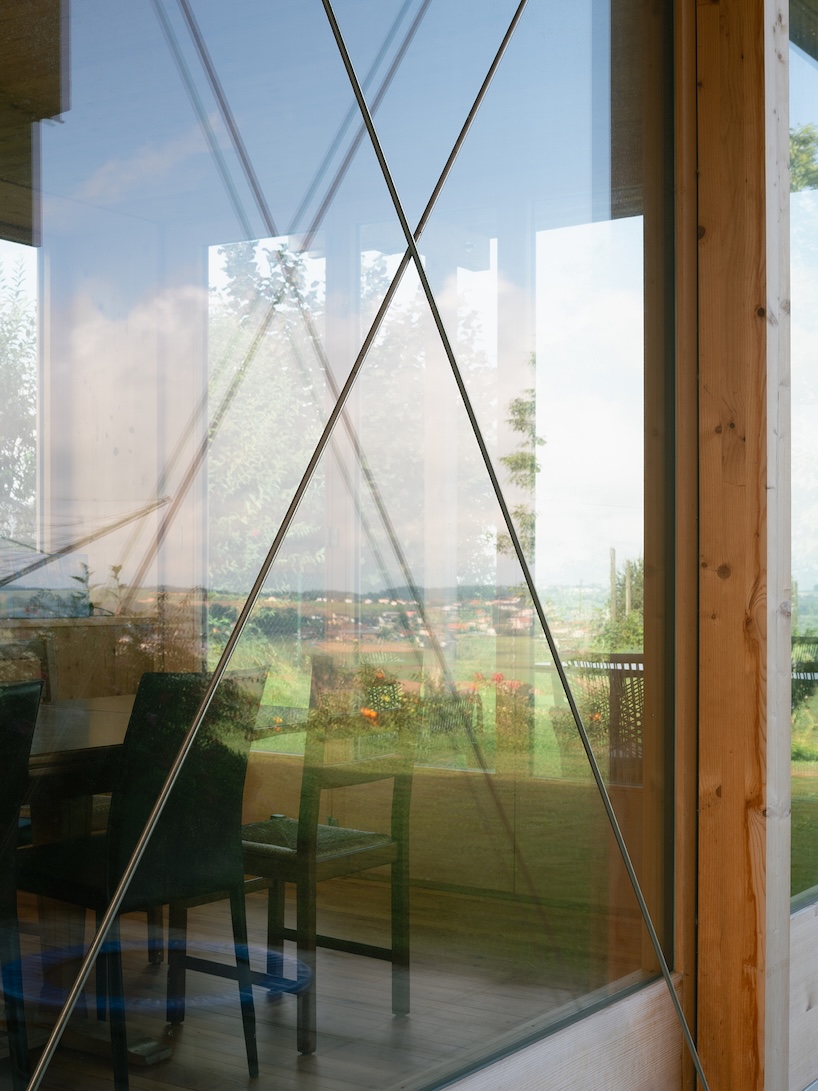 timber garden folly pavilion transitions between resting shelter and planted patio