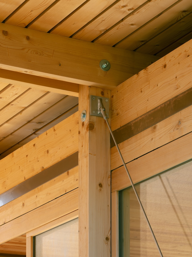 timber garden folly pavilion transitions between resting shelter and planted patio
