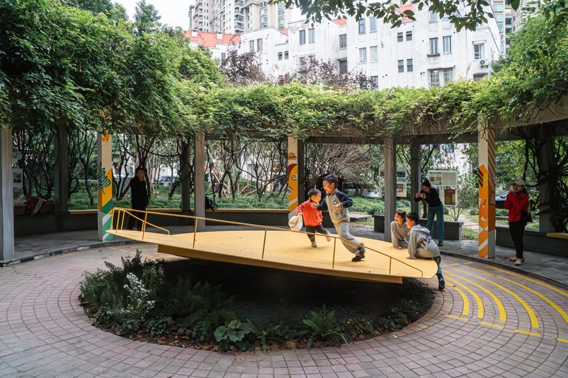 studio RE+N turns abandoned planter into floating yellow stage in shanghai neighborhood - 3
