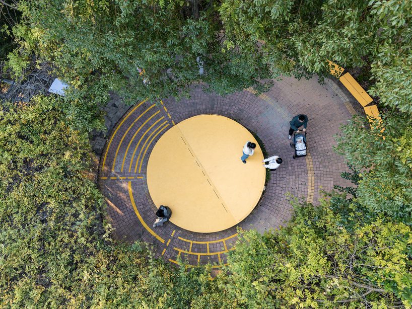 studio RE+N turns abandoned planter into floating yellow stage in shanghai neighborhood - 2