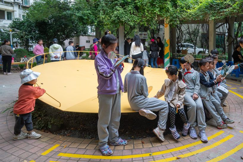 studio RE+N turns abandoned planter into floating yellow stage in shanghai neighborhood - 6