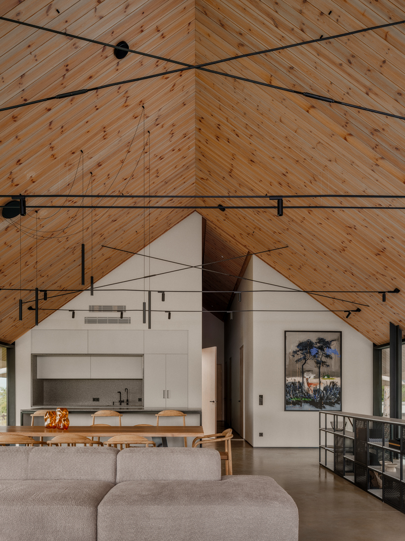 grass-covered seaside family home repurposes abandoned soviet military bunkers in latvia - 8