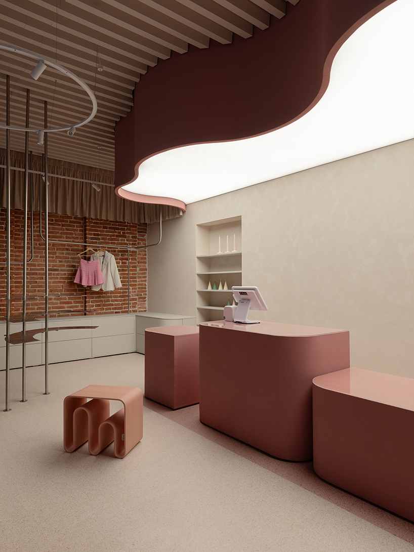curved pink interiors animate hybrid retail-caf&eacute; space within brick shell - 2