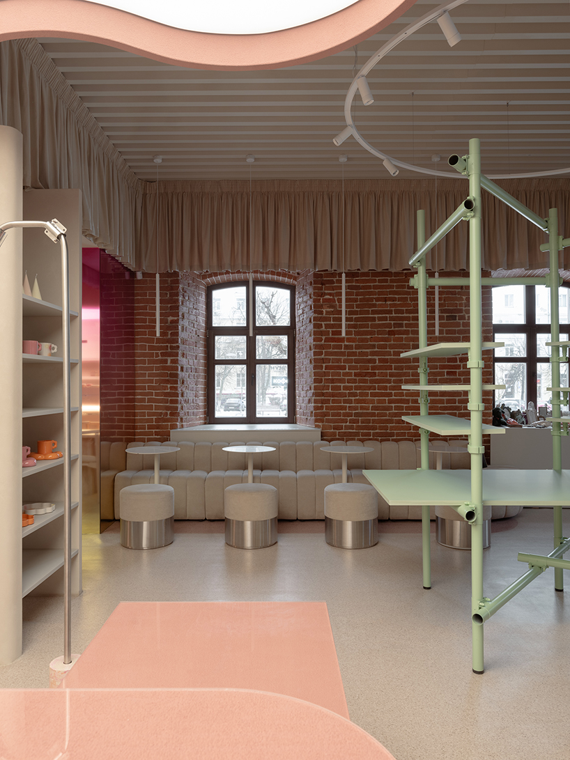 curved pink interiors animate hybrid retail-caf&eacute; space within brick shell - 10