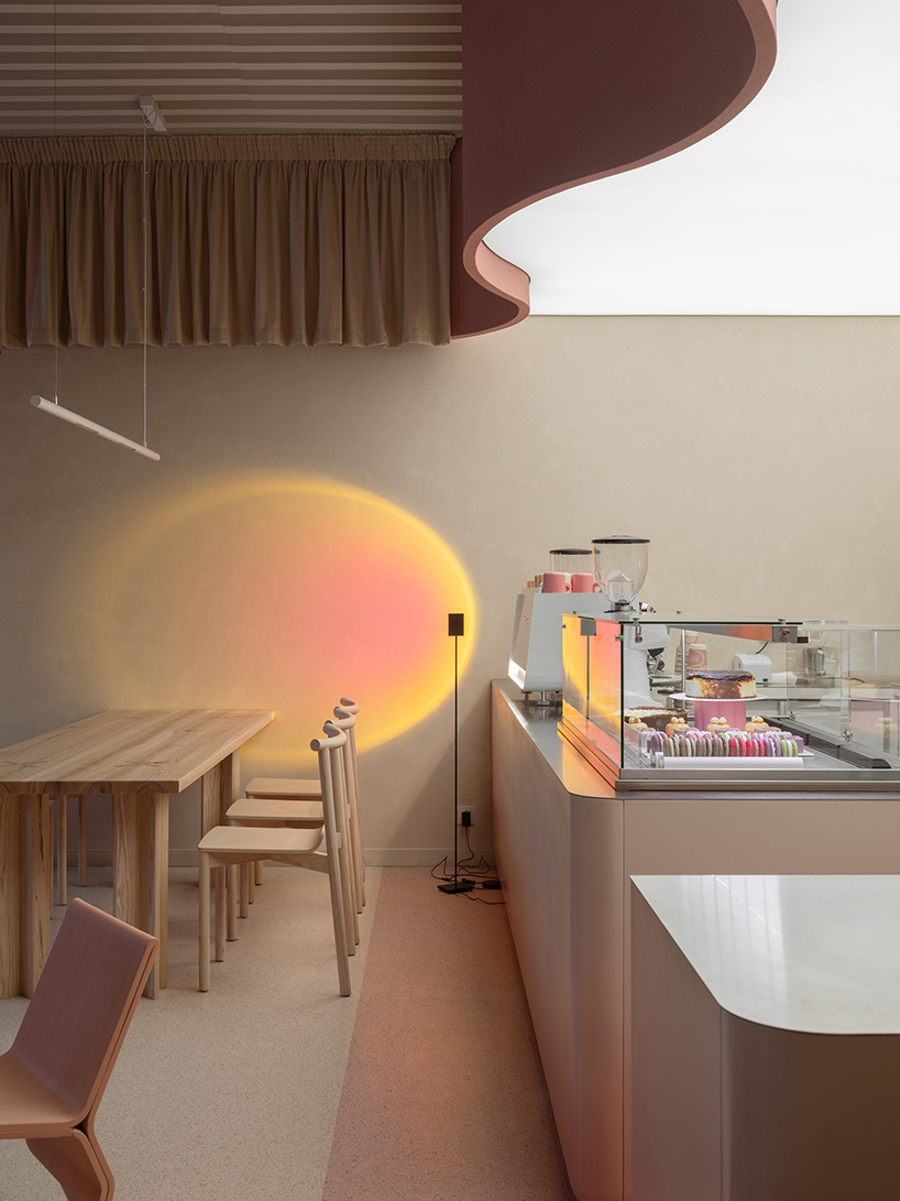 curved pink interiors animate hybrid retail-caf&eacute; space within brick shell - 3