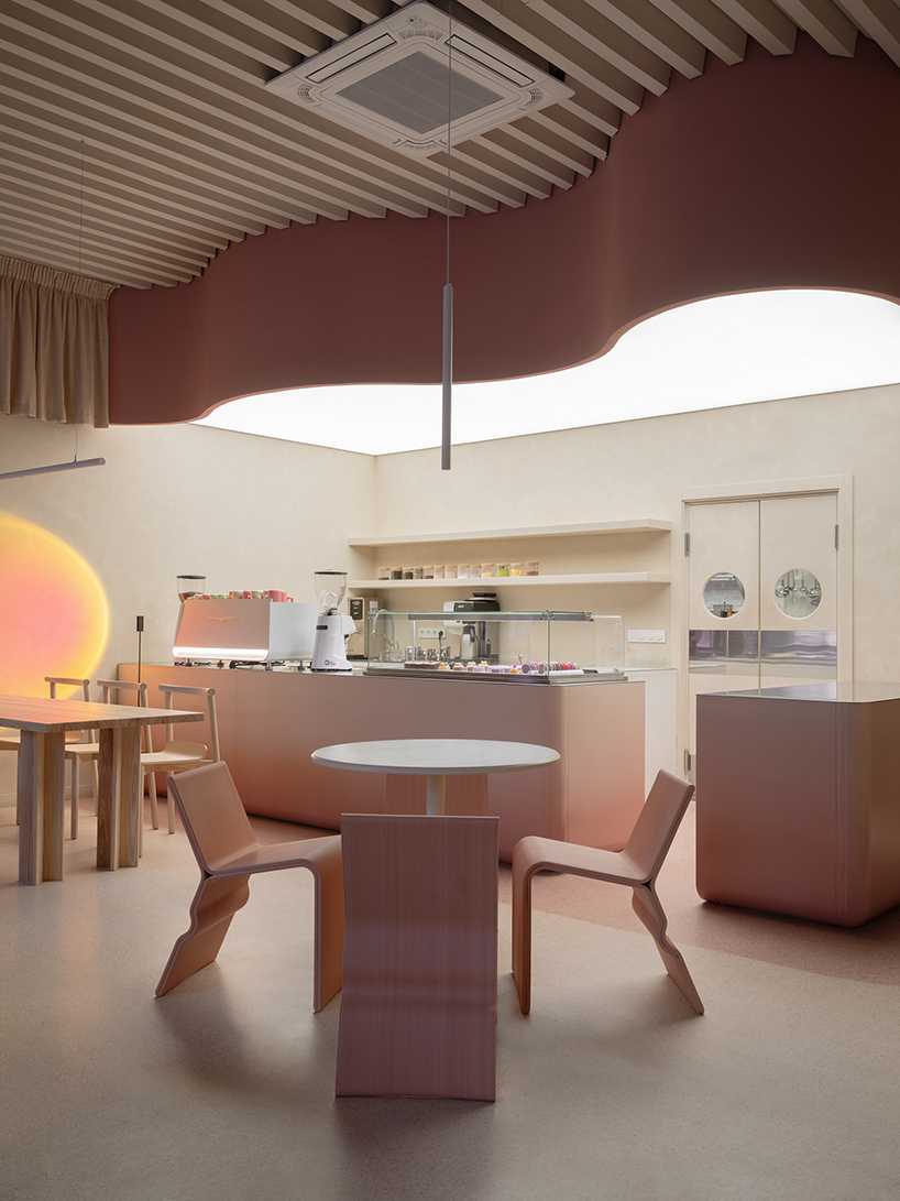curved pink interiors animate hybrid retail-caf&eacute; space within brick shell - 4